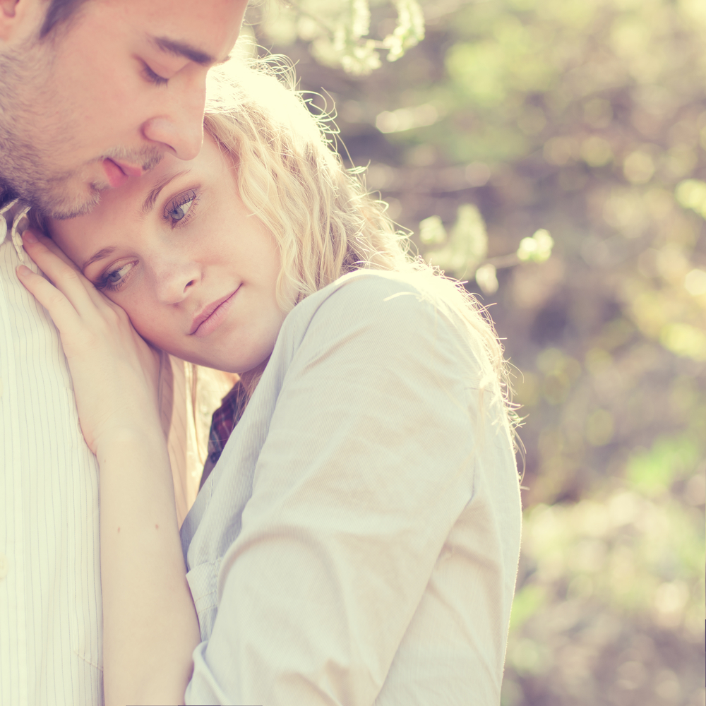 beautiful couple in love tenderly embraces - How to Know if a Leo Man Loves You