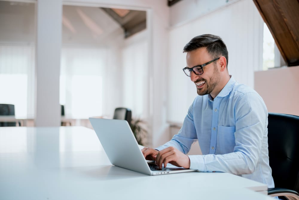 young man sitting at his desk in the office - Leo Man with Cancer Cusp